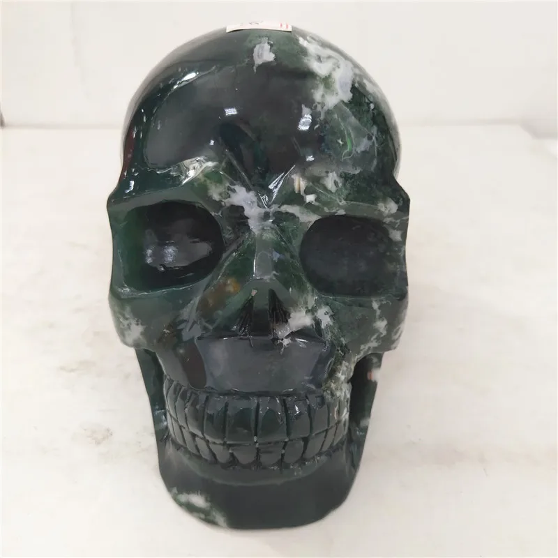 

Wholesale natural moss agate quartz carving skulls as home decoration