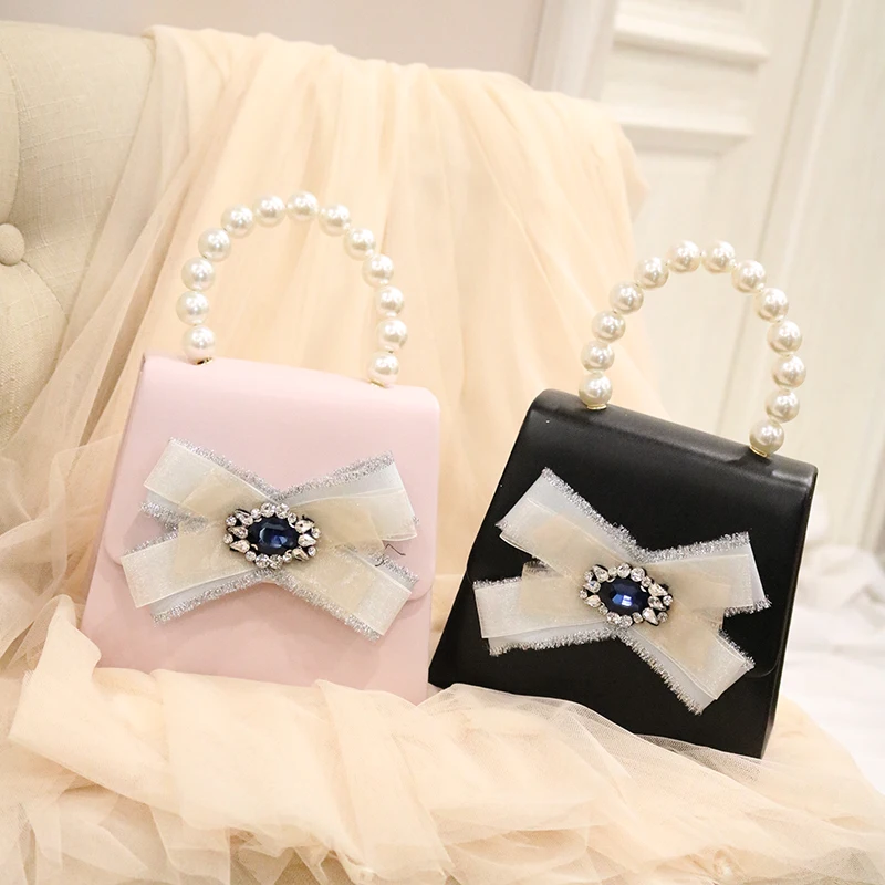 

Spring New Ins Super Fire Butterfly Knot with Diamond Pearl Hand Bill Shoulder Slant Bag Girl