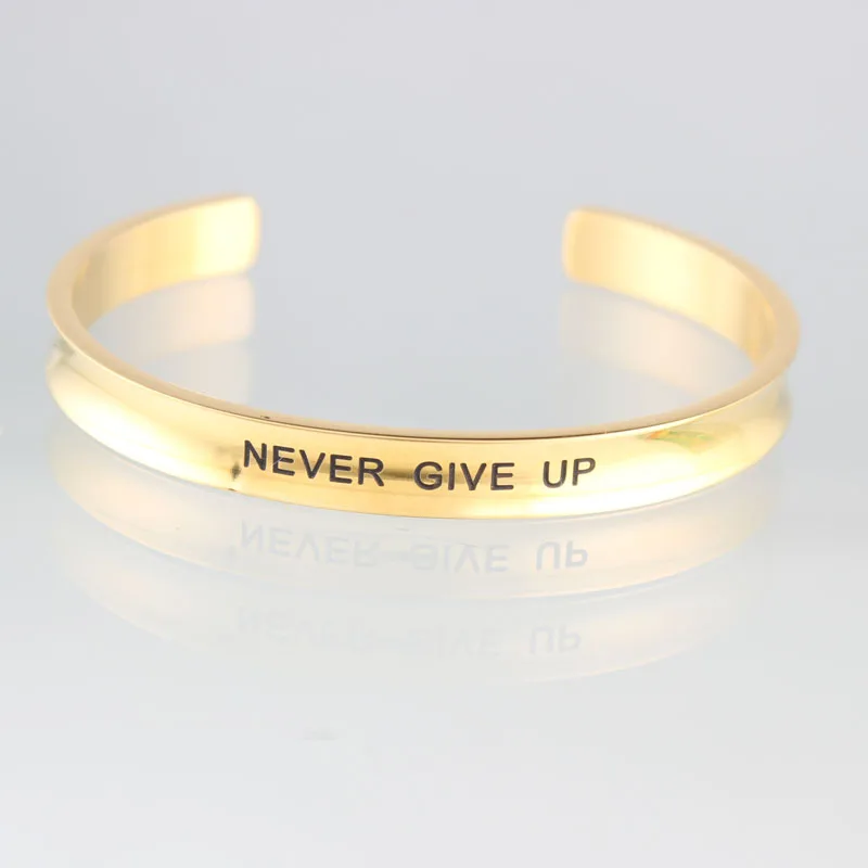 Никогда не сдается нержавеющая сталь на заказ Выгравированный положительный