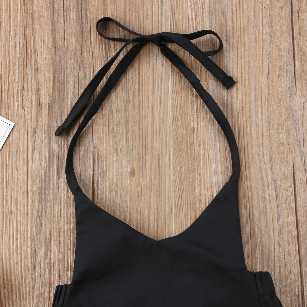 Черный комбинезон с открытой спиной и лямкой на шее для новорожденных девочек