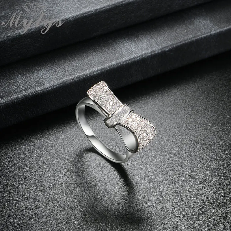 Mytys Новинка модное серебряное кольцо с закрепкой кристаллами бантом Свадебные