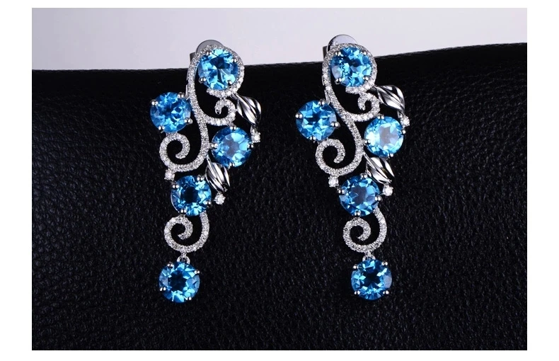 Белое золото 750 карата с натуральным голубым топазом и бриллиантами полной