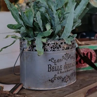 hand antiqued pierced metal bucket planter with handle