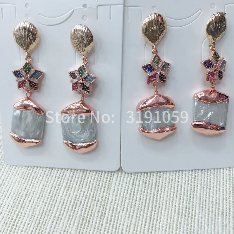 

Длинные серьги с натуральным орнаментом и асимметричным жемчугом
