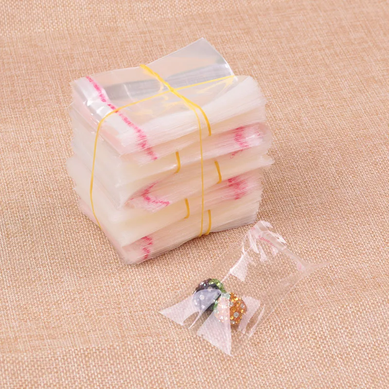 

Clear 200pcs 5x5cm+2cm Cellophane Package Plastic Gift Bags Jewelry Packaging Bag Plastic Poly OPP Bag Self Adhesive Seal Bags
