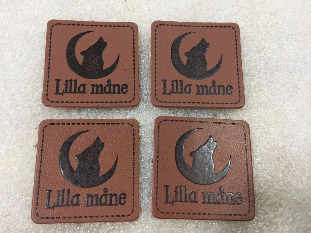 

Customized Embossed Logo PU Leather Label For Clothing