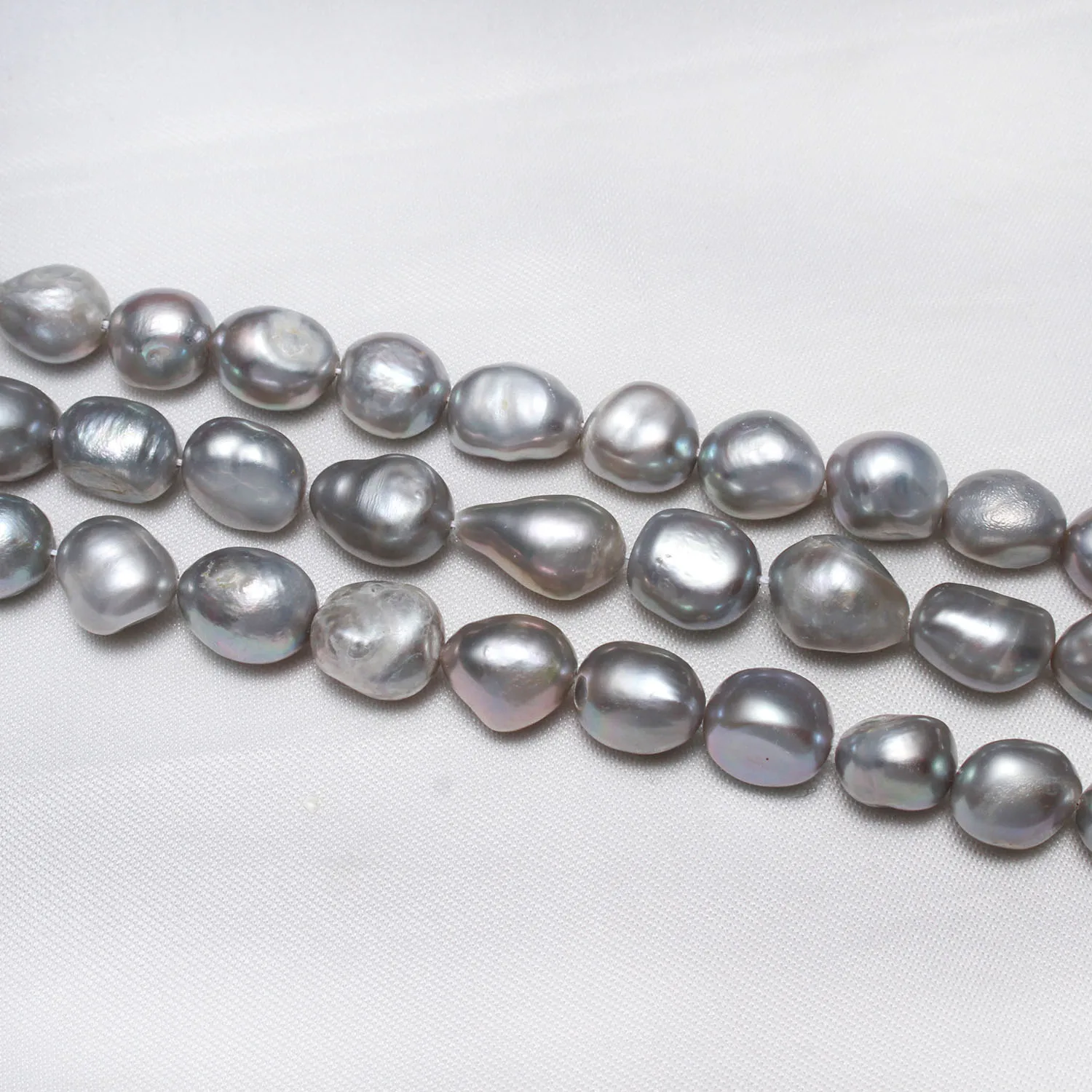 

Cultured Baroque Freshwater Pearl Beads Nuggets Grey 10-11mm Approx 0.8mm Sold Per 14.5 Inch Strand