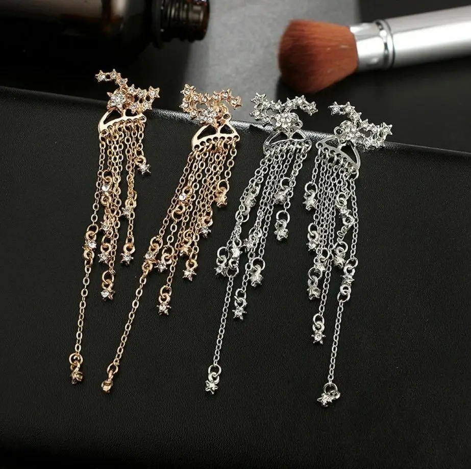 Женские длинные висячие серьги со стразами и кисточками серебряные с