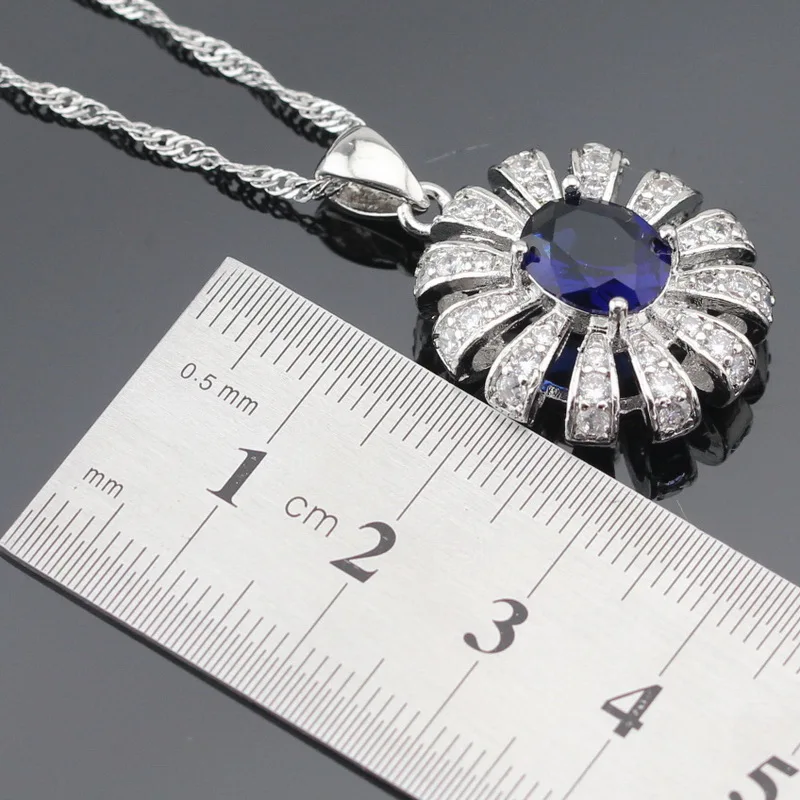 Женский серебряный ювелирный набор в форме цветка темно синий кристалл белый