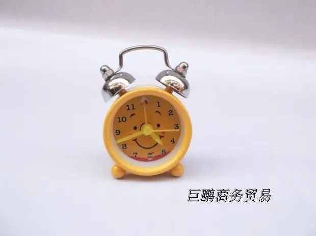Lovely small quartz clock 202 Mini cartoon alarm button batteries get up lazy students watch table |