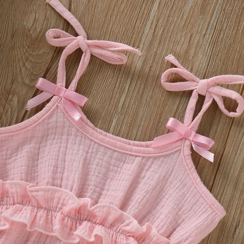 

Baby girl romper in summer children's cotton and linen solid color sling romper for 0-24M