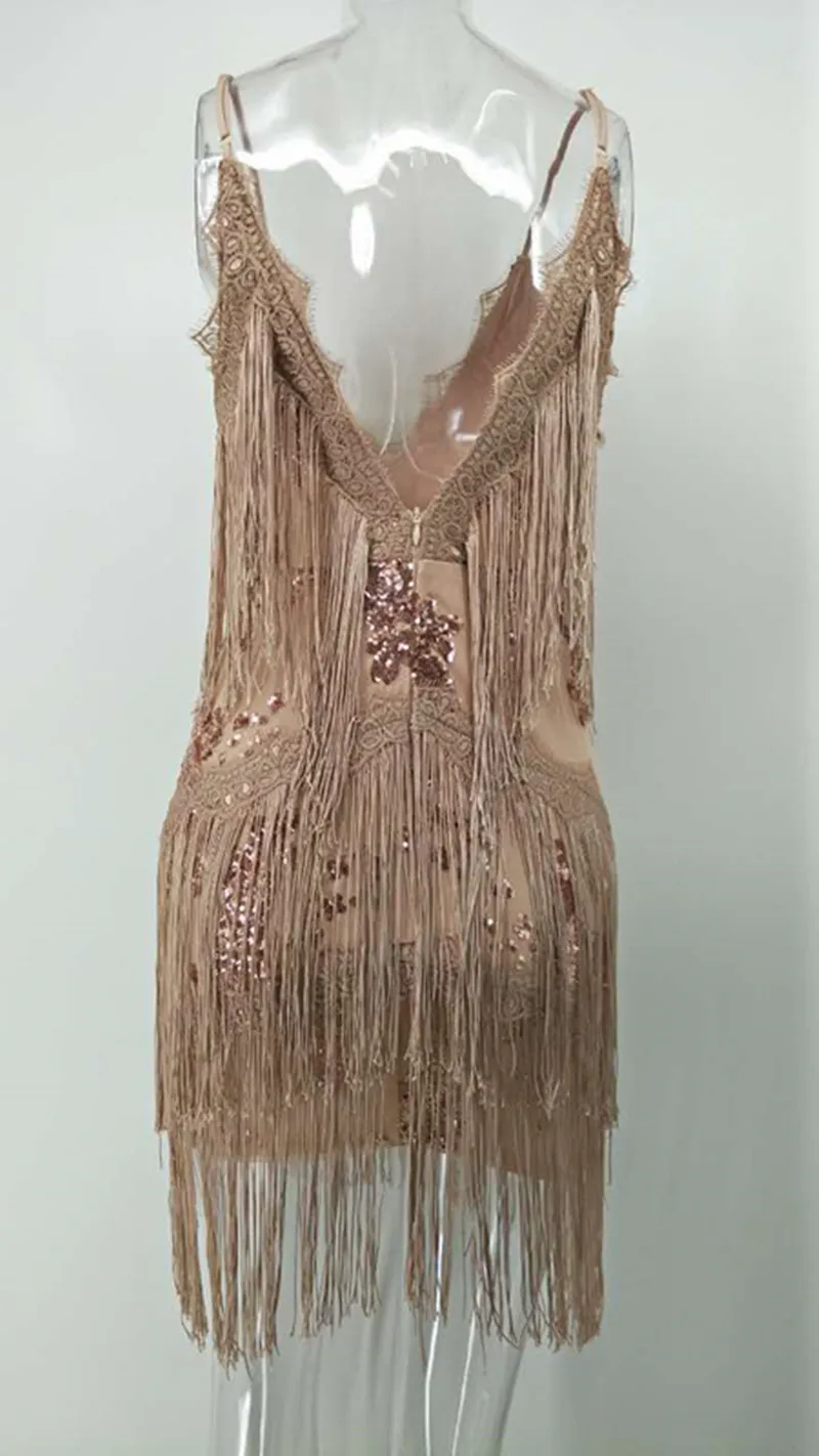 Женское облегающее мини-платье с блестками глубоким v-образным вырезом и