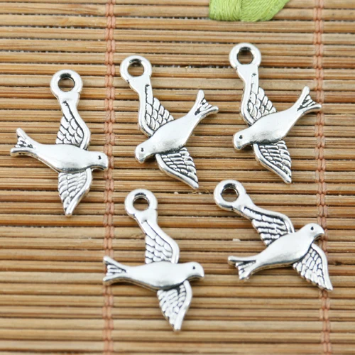 

52pcs tibetan silver tone 2sided flying bird charms EF2212