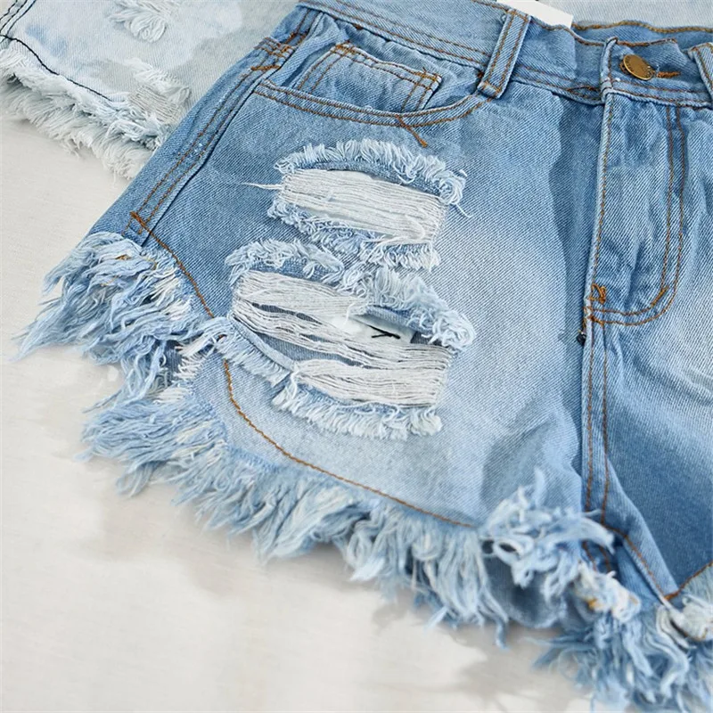 Шорты женские джинсовые с дырками модные рваные пикантные бахромой и завышенной
