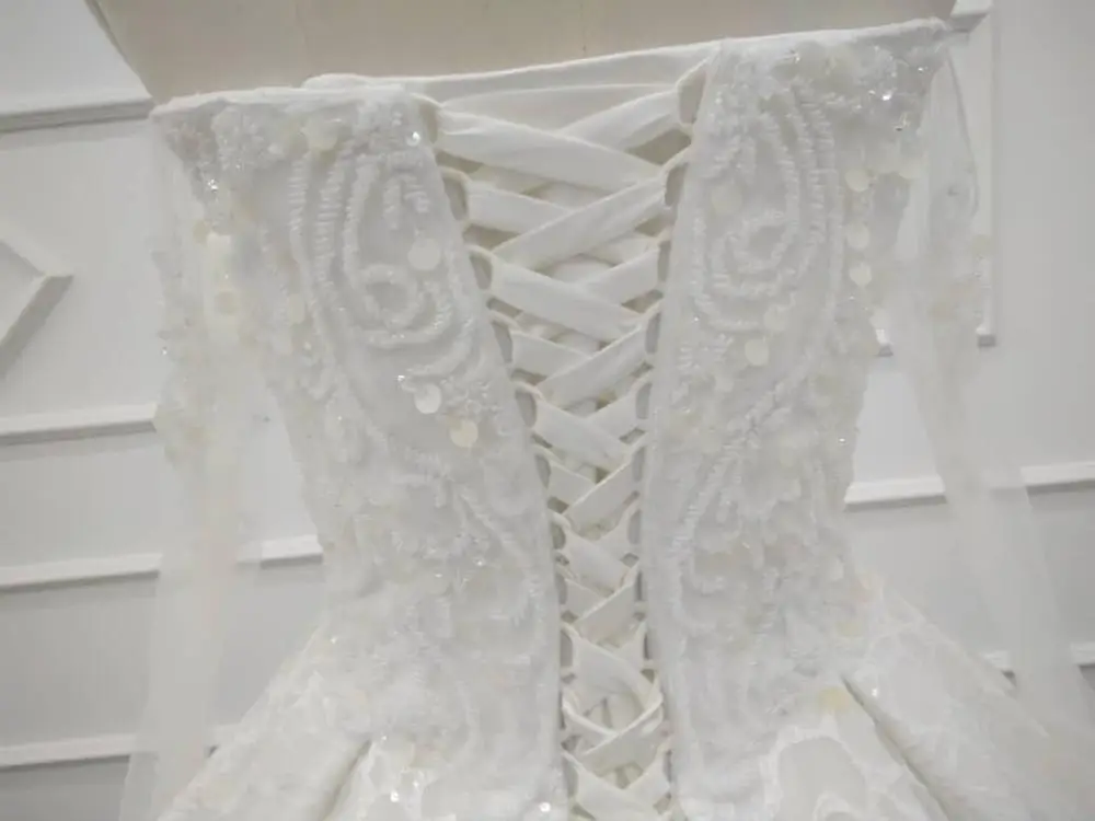 

Eslieb high quality turkey luxury long sleeve ivory sheer bodice lace appliques sexy wedding dress bridal gown 2019 SJ034