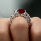 Женское серебряное кольцо в форме крыла ангела с красным Цирконом