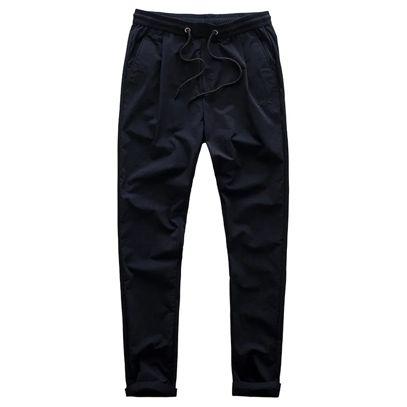 Повседневные брюки для мужчин тонкие весенне-летние без глажки узкие штаны из