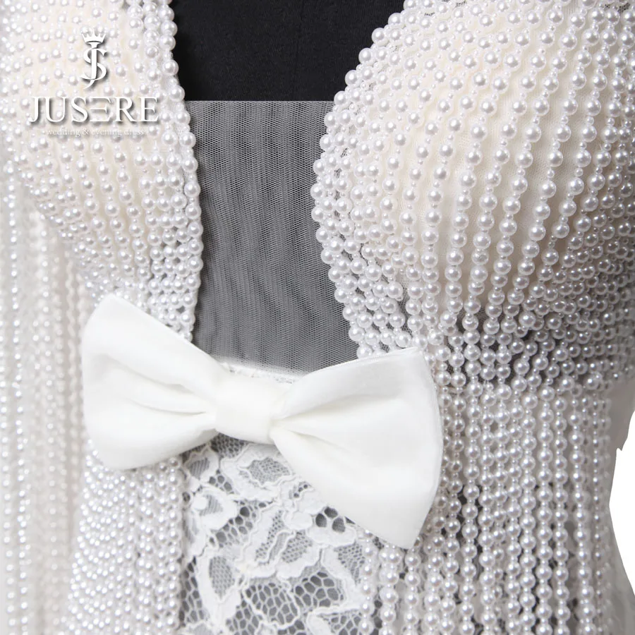 Кружевное свадебное платье цвета слоновой кости с глубоким V-образным вырезом