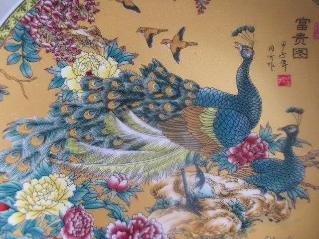 

China's rich and colorful handmade ceramic painting board by the peacock
