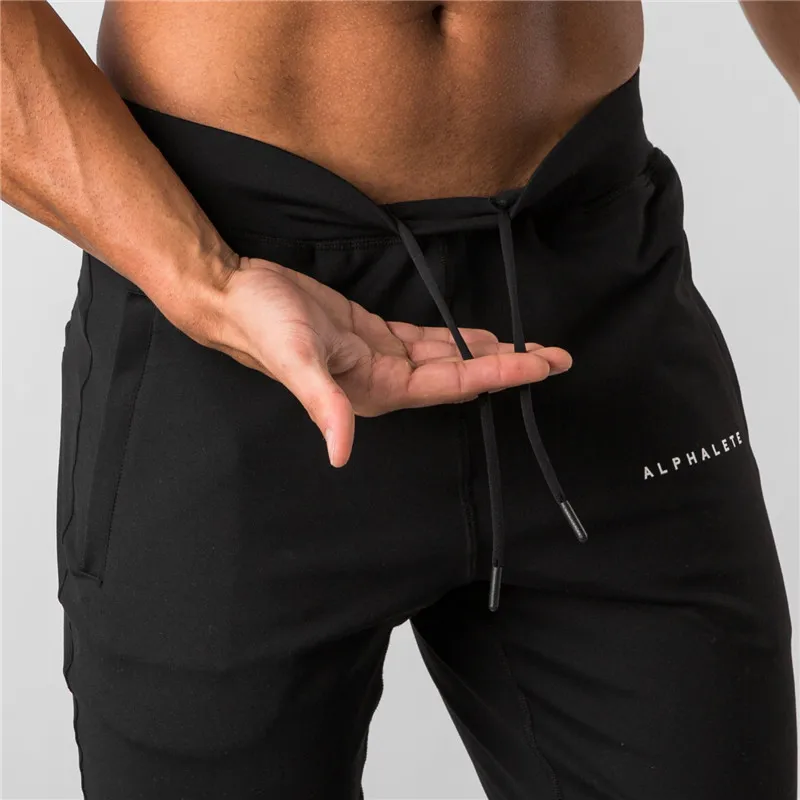 Новинка, стильные мужские спортивные штаны ALPHALETE Jogger, мужские спортивные штаны для тренировок, фитнеса, хлопковые брюки, мужские повседневные Модные обтягивающие спортивные штаны