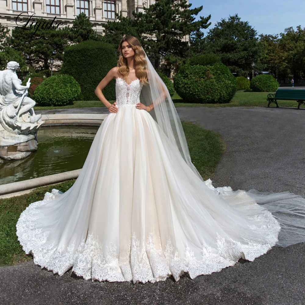 

Liyuke Ivory Color Sweetheart Neckline A Line Wedding Dress With Court Train Tulle And Organza Sleeveless Wedding Gown