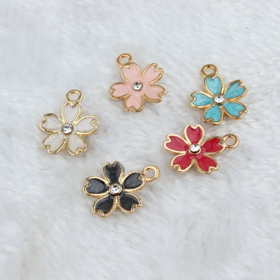 

Wholesale Crystal Rhinestone Core Glitter Enamel Alloy Flower Charms Oil Drop Sakura Flowers Gold Tone Alloy Jewelry Pendants