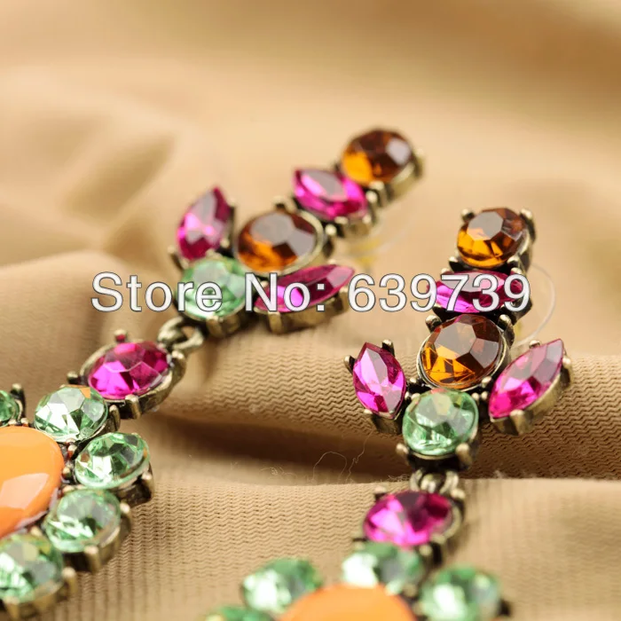 Винтажные антикварные серьги из разноцветной смолы золотого цвета по оптовой