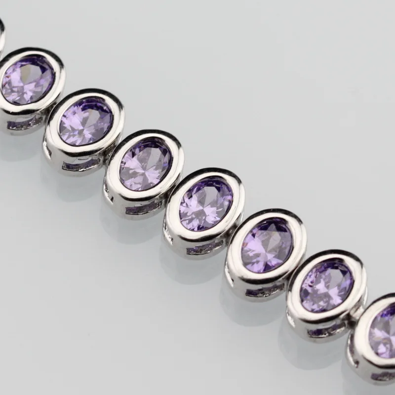 Привлекательный браслет серебряного цвета с фиолетовым цирконом модные