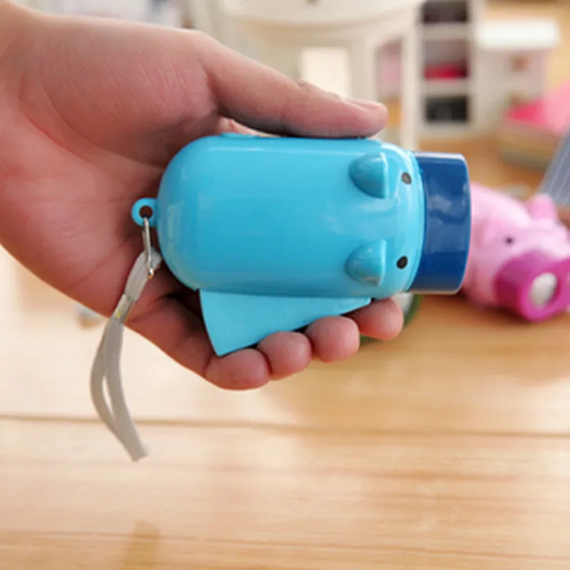 

Portable hand-pressure power generation flashlight cute pig luminous toy LED outdoor emergency lighting Color random