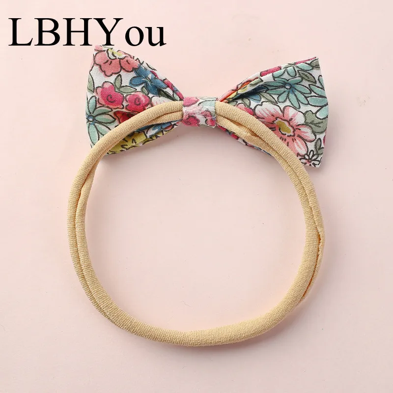 

1PCS Children Kids Bows Hair Accessories Flowers Print Fabric Elastic Bowknot Nylon Headbands Baby Stretchy Hair Bands 6.5*5.5cm
