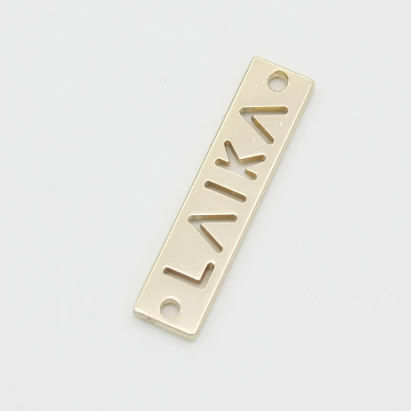 

100pcs high quality garment gold metal embossed labels handmade sewing labels for clothes 0.7*2.5cm letter clothing nameplate
