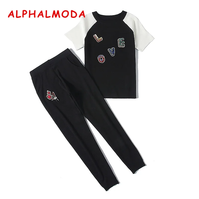 Женский вязаный костюм ALPHALMODA свитер с аппликацией букв + штаны цветами комплект