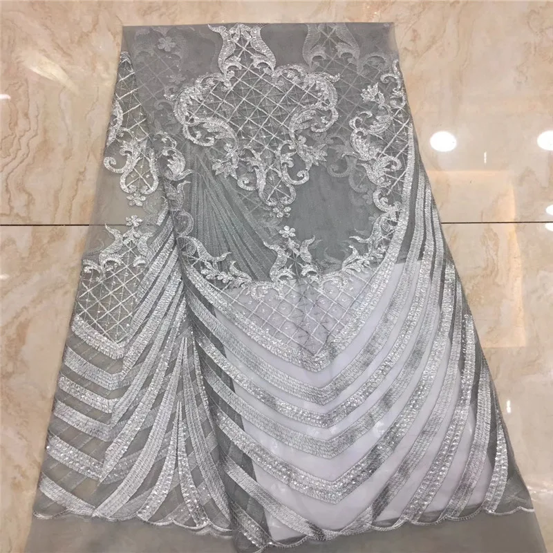 

Cassiel Power White Lace Fabric with Sequins African Popular Style Tulle Lace Fabric for Women Wedding Dress