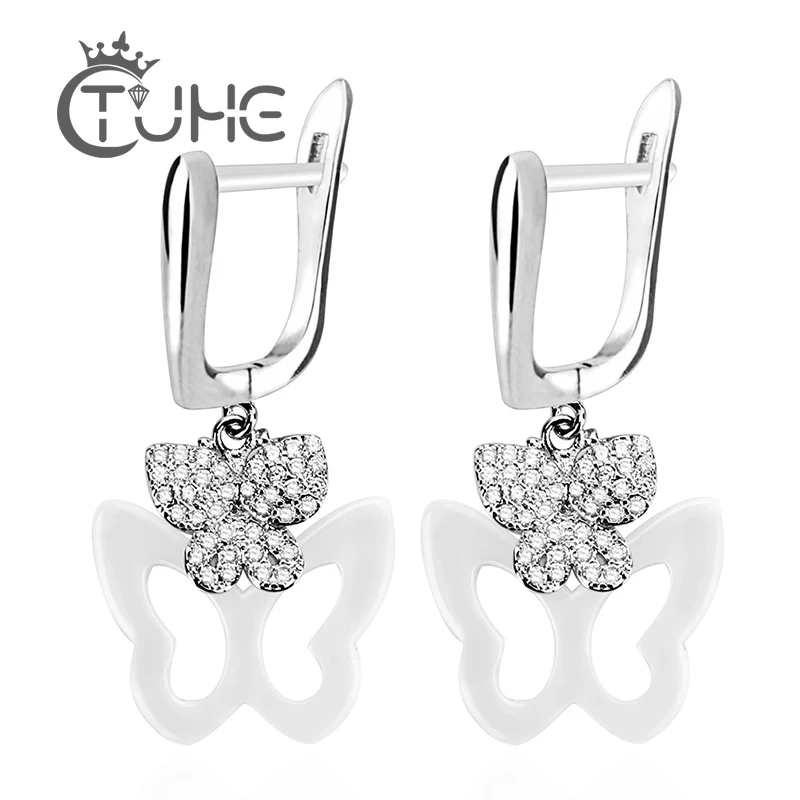 Комплект сережек бабочек с кристаллами черно белые керамические модные