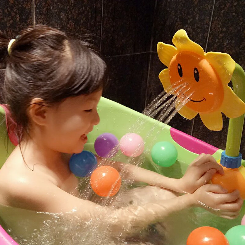 

Bathing toys, baby sunflowers, sprinklers, electric water spray, sunflower children, boys and girls playing with water.