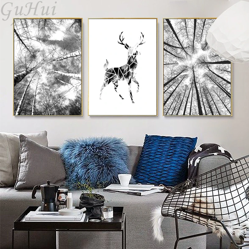 Постер на холсте с изображением черно белых деревьев и животных олени голубой