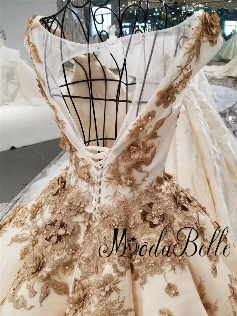 Платье для свадьбы Modabelle Deluxe цвета шампанского золотого с объемным цветком
