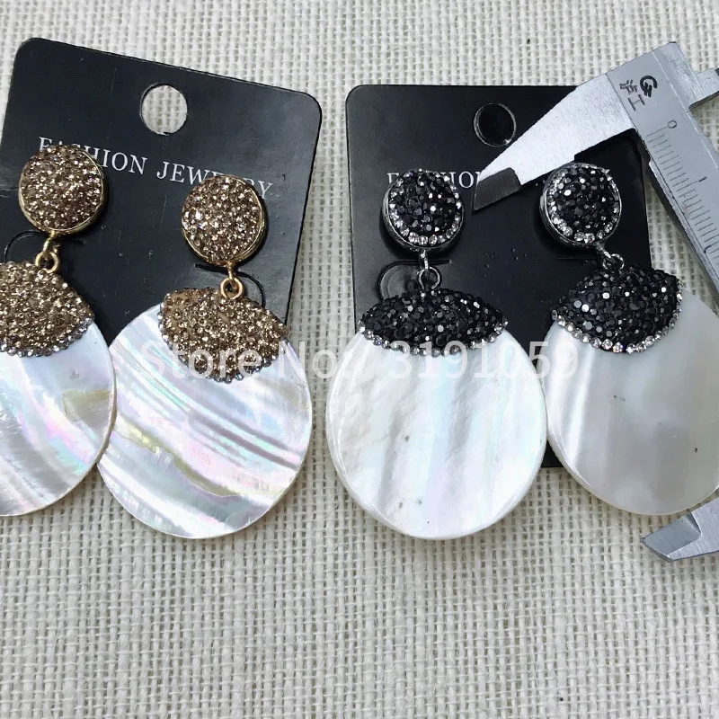 

Круглые длинные темпераментные женские серьги-ракушки 2018