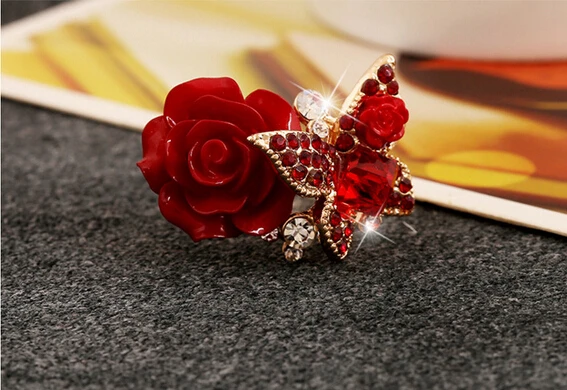 Женское кольцо с большим кристаллом регулируемое золотистого цвета цветком розы