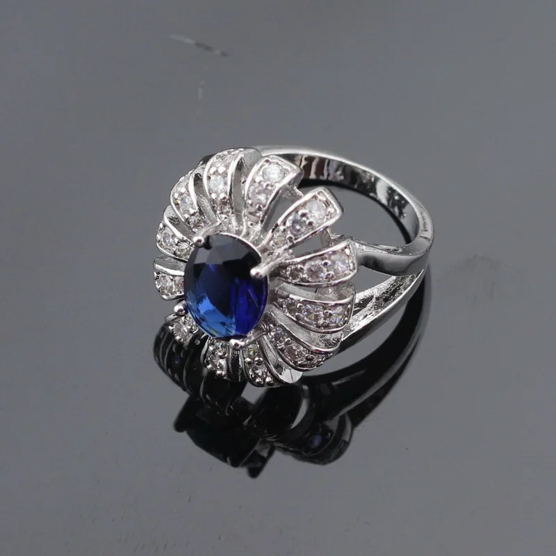 Женский серебряный ювелирный набор в форме цветка темно синий кристалл белый