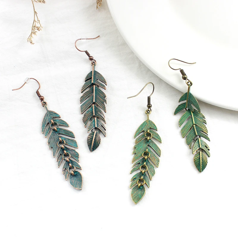 Серьги в форме листика разбивающие листья вшитые полный комплект винтажные