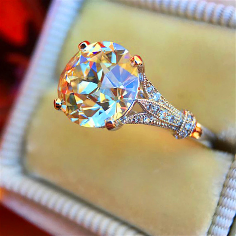 

Loredana, stylish luxury female white bride gets married with a round super shiny semi-precious stone engagement ring