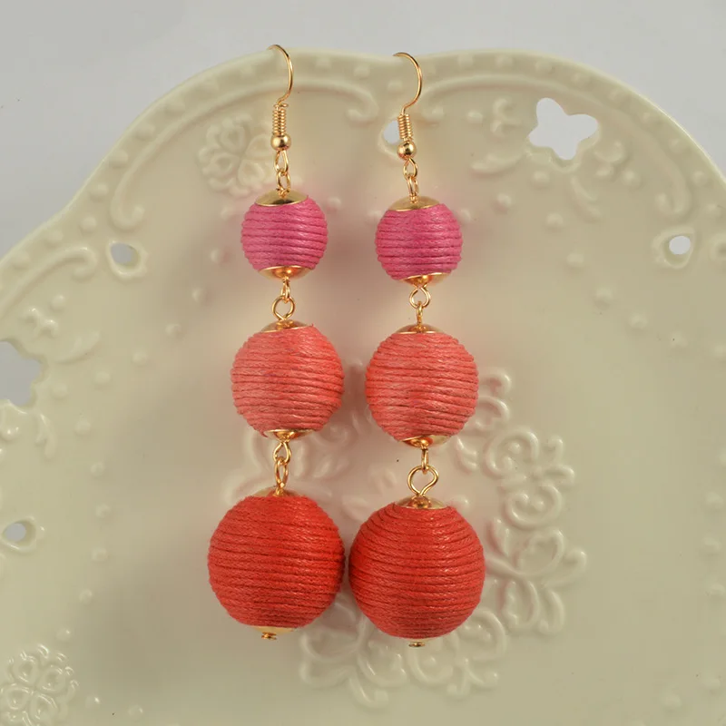 Меховым бубоном Бон плюшевые серьги шарики завернутый шарик Crispin падение Pom