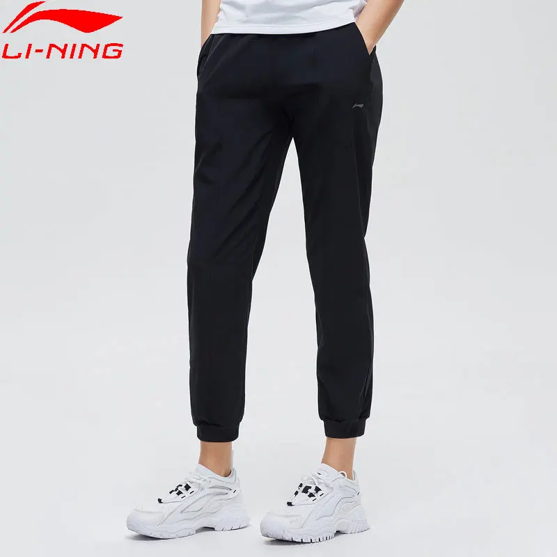 Женские тренировочные брюки Li Ning прямые из 86% полиэстера с подкладкой спандекса