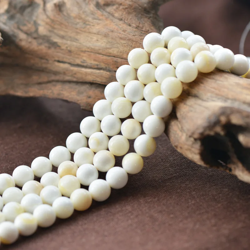 Оптовая продажа натуральный белый золотые полосы Tridacna камень Бусины для