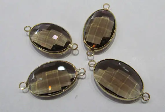 Овальный яйцообразный подвеска из стекла Топаз и Дымчатого кристалла, 12 штук, соединенных фасетированным двойным коннектором, в оригинальной версии из Смоки Рока с покрытием родием.