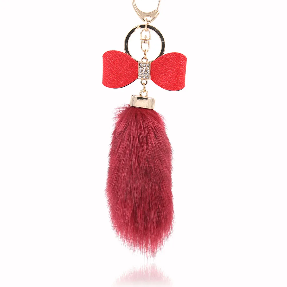 Кожаный брелок с бантом и меховым шариком аксессуар для сумки кристаллами