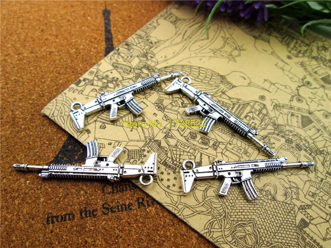 

10pcs machine gun Charms Antiqued Silver Tone 2 sided machine gun charm pendants 45x16mm