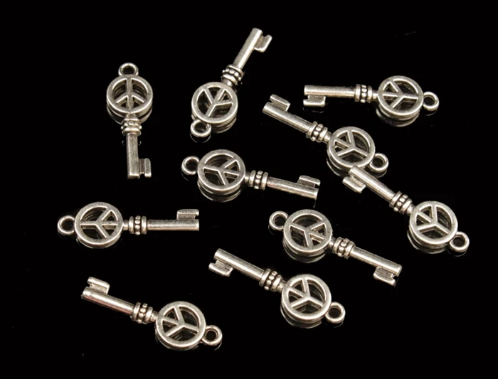 

free shipping 50pcs tibetan silver metal peace logo key charms A30031