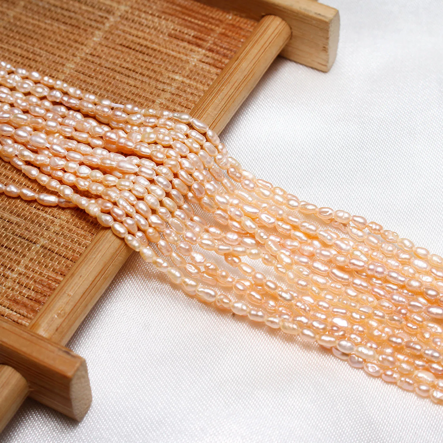 

Культивированный рис пресноводные жемчужные бусины натуральный розовый 2-2,5 мм прибл. 0,8 мм продан за приблизительно 15,5 дюйма прядь